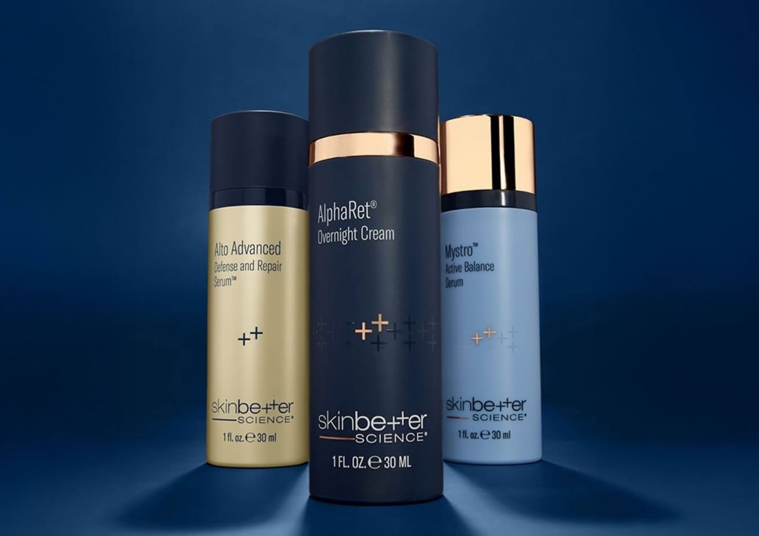 Three SkinCeuticals serum bottles with dropper tops arranged in a row on a dark background.
